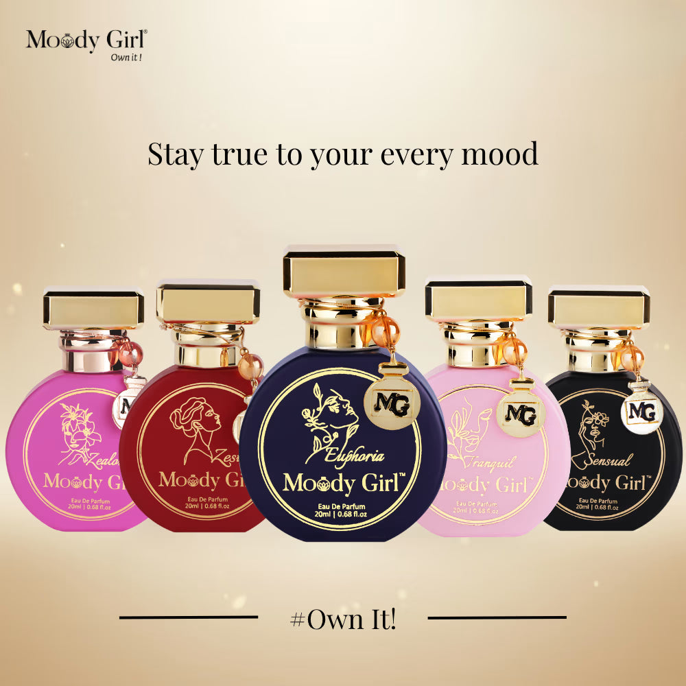 Five Moody Girl perfume bottles on a beige background with text 'Stay true to your every mood' and '#Own It!'.