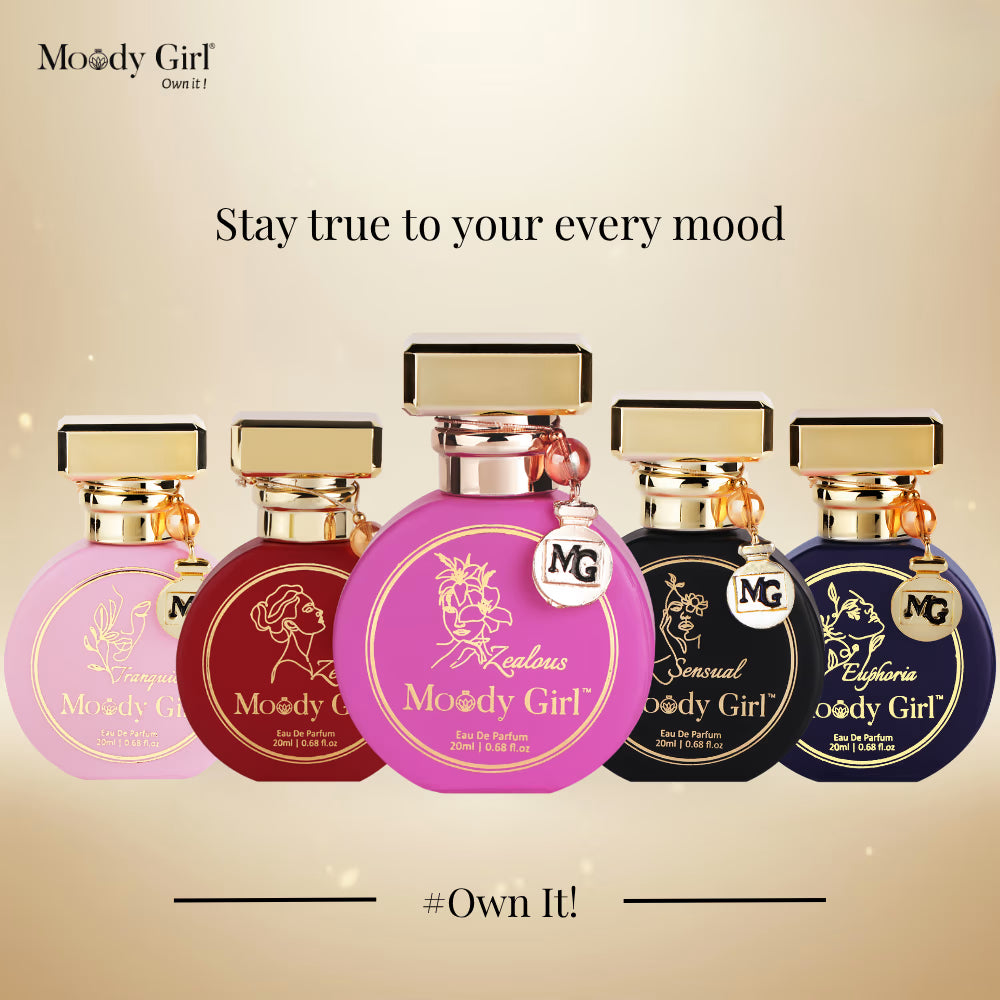 Five Moody Girl perfume bottles on a beige background with text 'Stay true to your every mood' and '#Own It!'.