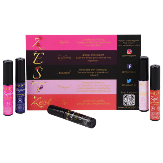 Collection of perfume bottles with a branded box on a white background