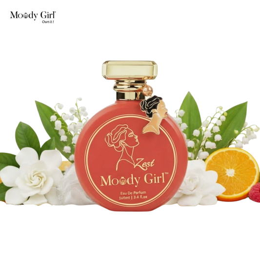 Moody Girl perfume bottle with floral and fruit elements on a white background