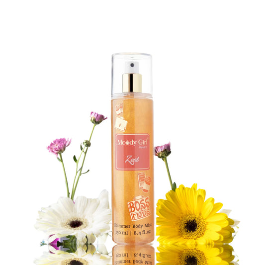 Moody Girl Zest shimmer body mist with flowers on a white background