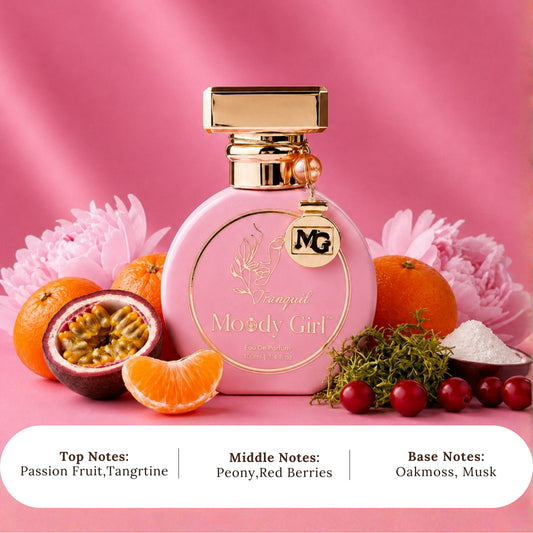 A pink perfume bottle labeled 'Fragrant Moody Girl' with gold detailing, surrounded by citrus fruits, a sliced passion fruit, pink flowers, and berries on a pink background. Three white text banners at the bottom list the scent notes.