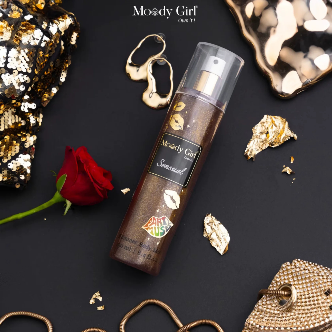 Moody Girl perfume bottle with decorative elements on a black background
