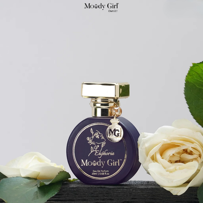 Moody Girl Euphoria perfume bottle with white roses on a light gray background