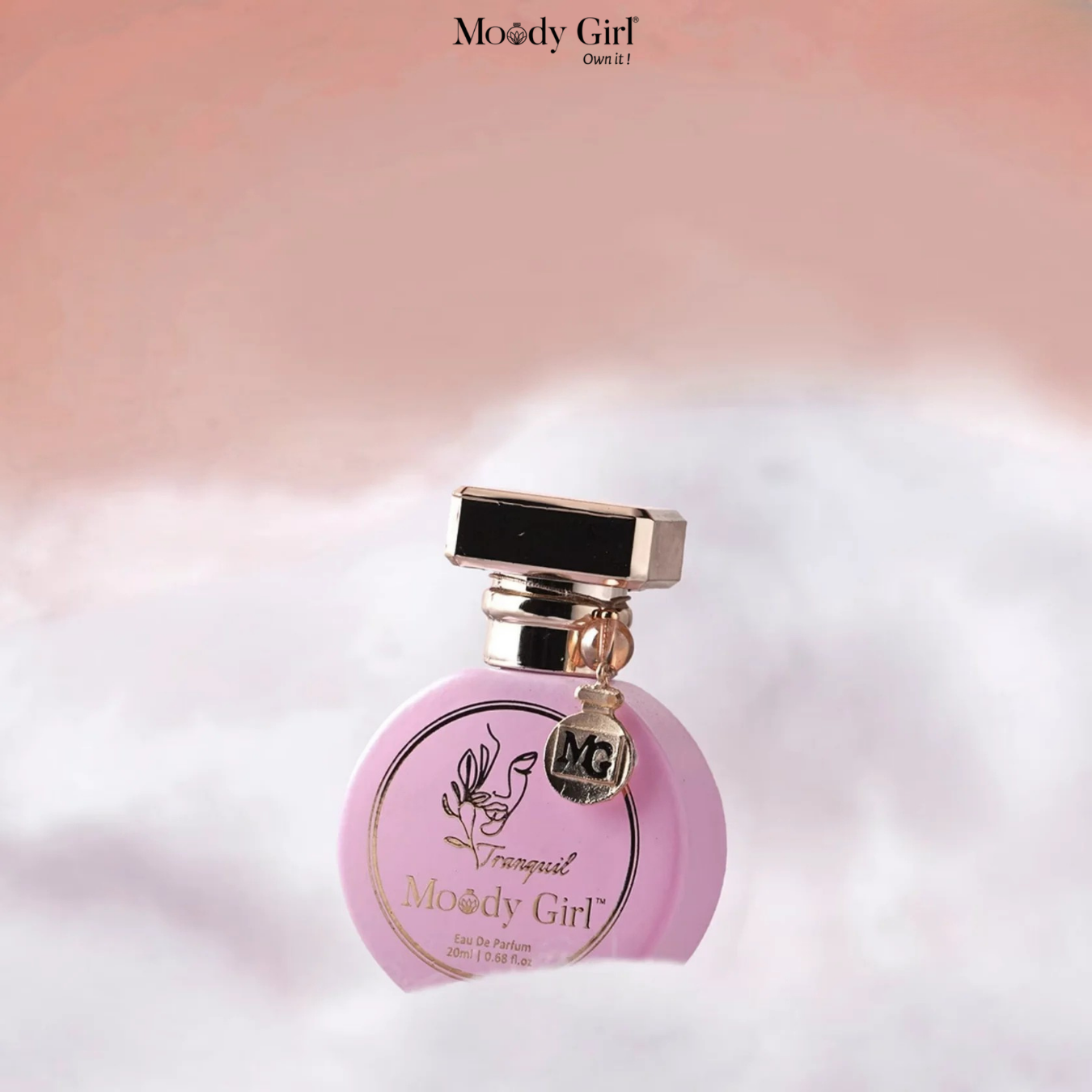 Pink perfume bottle with gold accents on a soft, blurred background