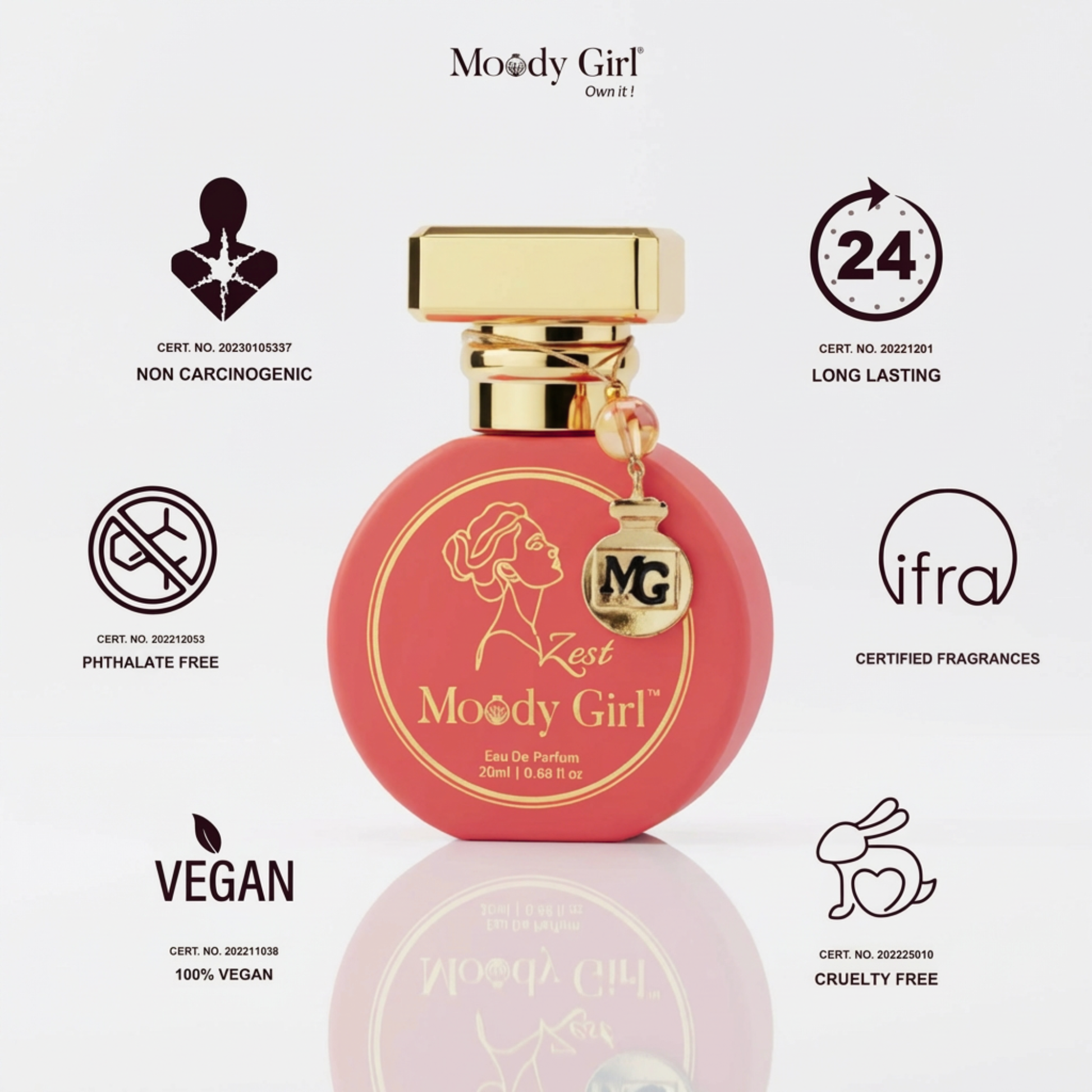 Pink perfume bottle with gold cap labeled 'Moody Girl' on a white background with certification icons.