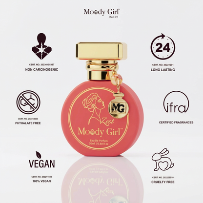 Pink perfume bottle with gold cap labeled 'Moody Girl' on a white background with certification icons.