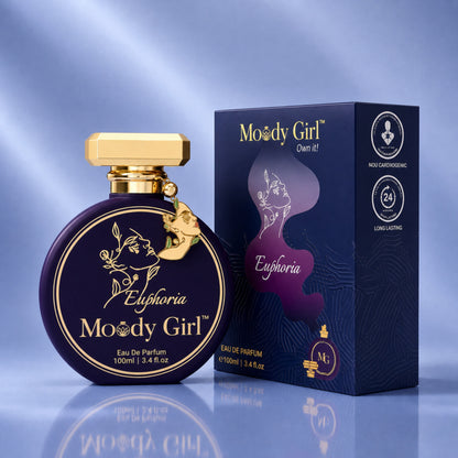 Moody Girl Eau De Parfum 100ml bottle and its packaging box, featuring a deep purple color with gold lettering and cap, set against a blue gradient background.