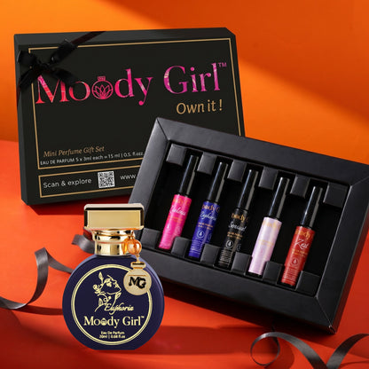 Moody Girl mini perfume gift set with a bottle on an orange background