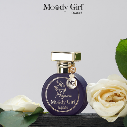 Moody Girl Euphoria perfume bottle with white roses on a light gray background