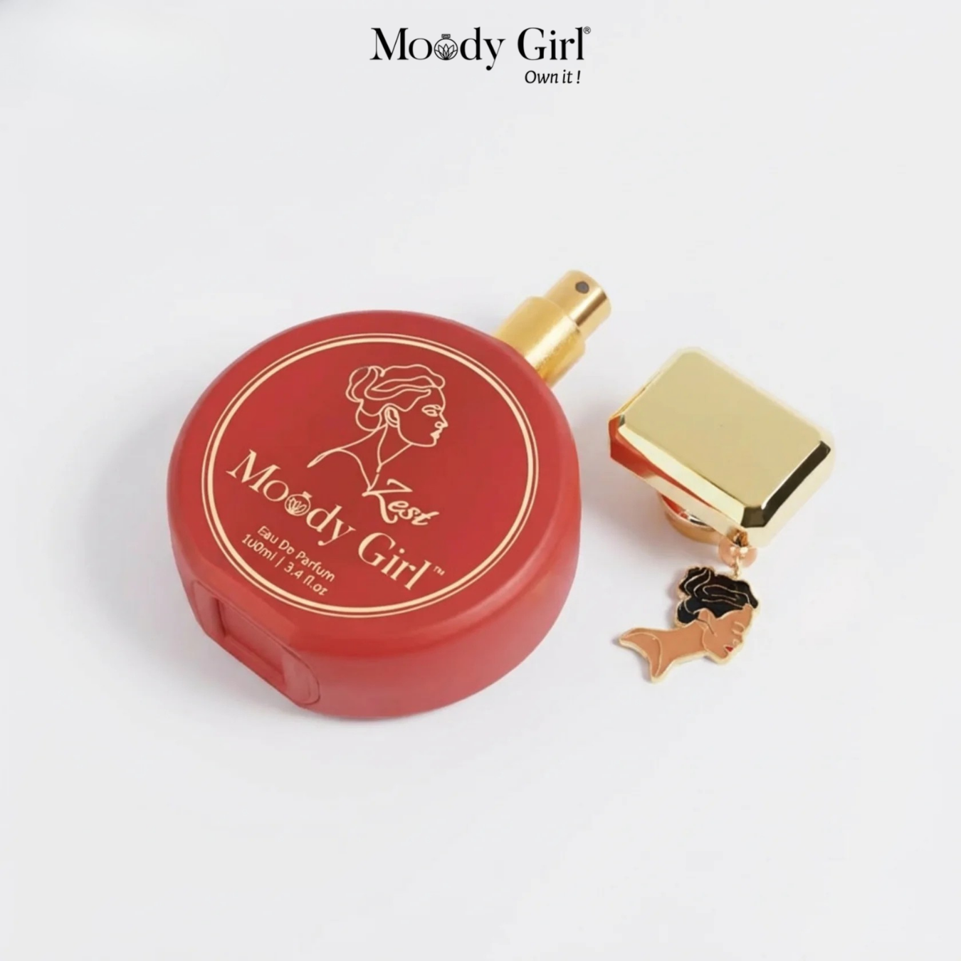 Red perfume bottle with gold cap and 'Moody Girl' branding on a white background