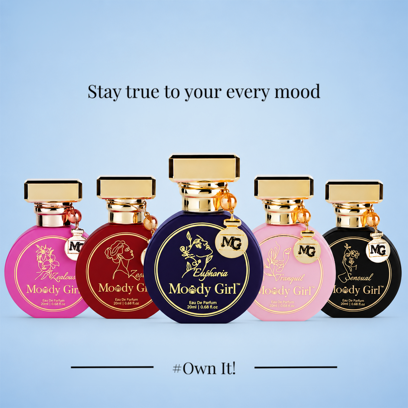 Five perfume bottles from the brand MG, labeled 'Moody Girl' in pink, burgundy, navy blue, light pink, and black, arranged against a light blue gradient background with text 'Stay true to your every mood' and '#Own It!'.