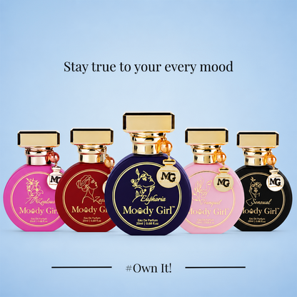 Five perfume bottles from the brand MG, labeled 'Moody Girl' in pink, burgundy, navy blue, light pink, and black, arranged against a light blue gradient background with text 'Stay true to your every mood' and '#Own It!'.