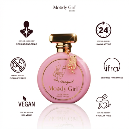 Pink perfume bottle with gold accents on a white background, featuring Moody Girl branding and certification logos.