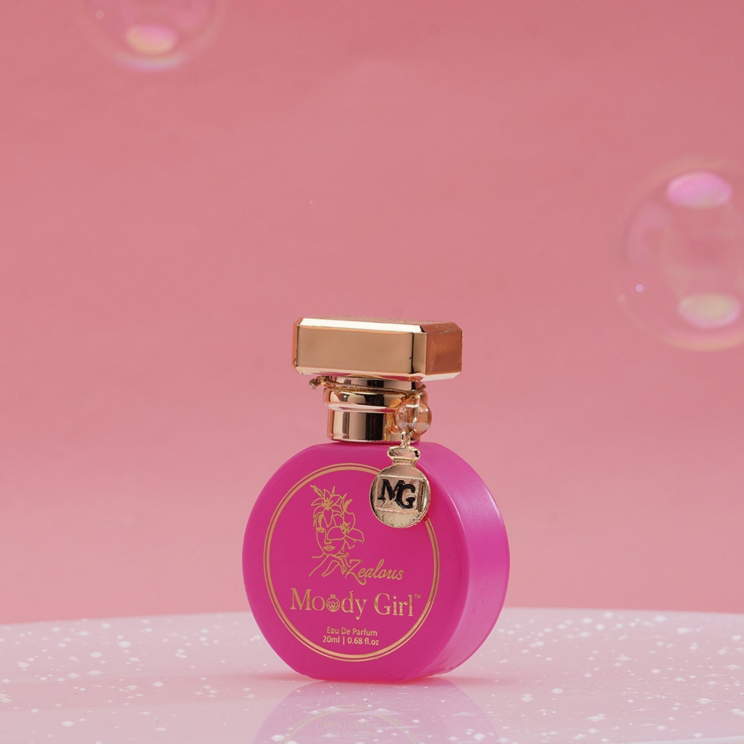 Moody Girl Zealous 20ml Pink perfume bottle with gold cap on a pink background
