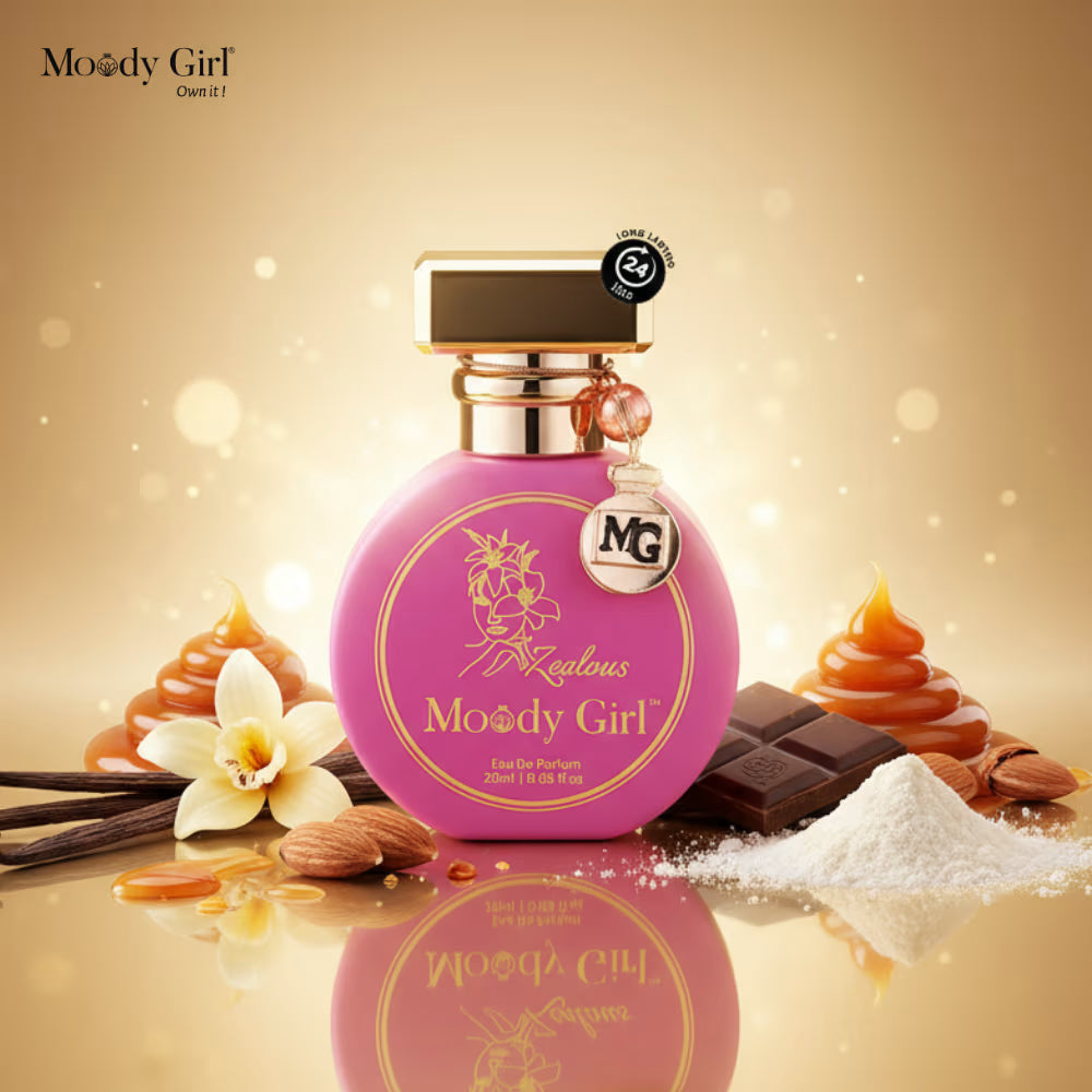 Pink perfume bottle with gold accents on a reflective surface, surrounded by vanilla beans, chocolate, and flowers.