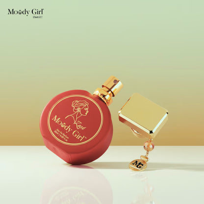 Red and gold perfume bottle with 'Moody Girl' branding on a gradient background