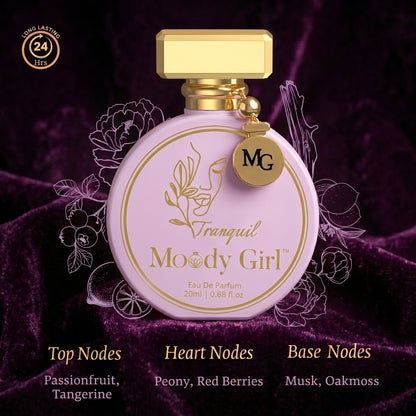 Perfume bottle labeled 'Tranquil Moody Girl' with gold accents on a dark purple background.