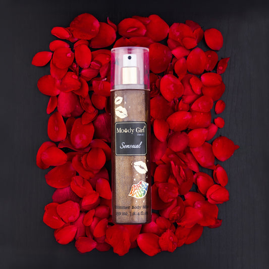 Moody Girl Sensual body mist surrounded by red rose petals on a black background